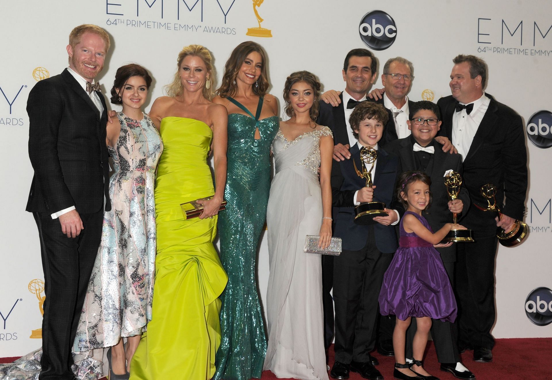 Vergara (fourth from left) at the 2012 Emmys red carpet (Image via Getty)